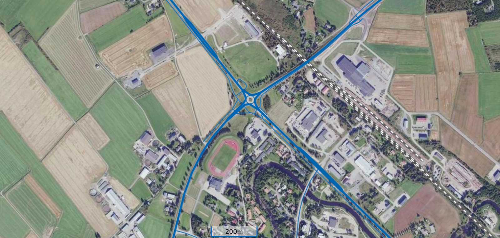 A screenshot of the Suomen Väylät map service showing an ortophoto layer with road and rail network layers on top.